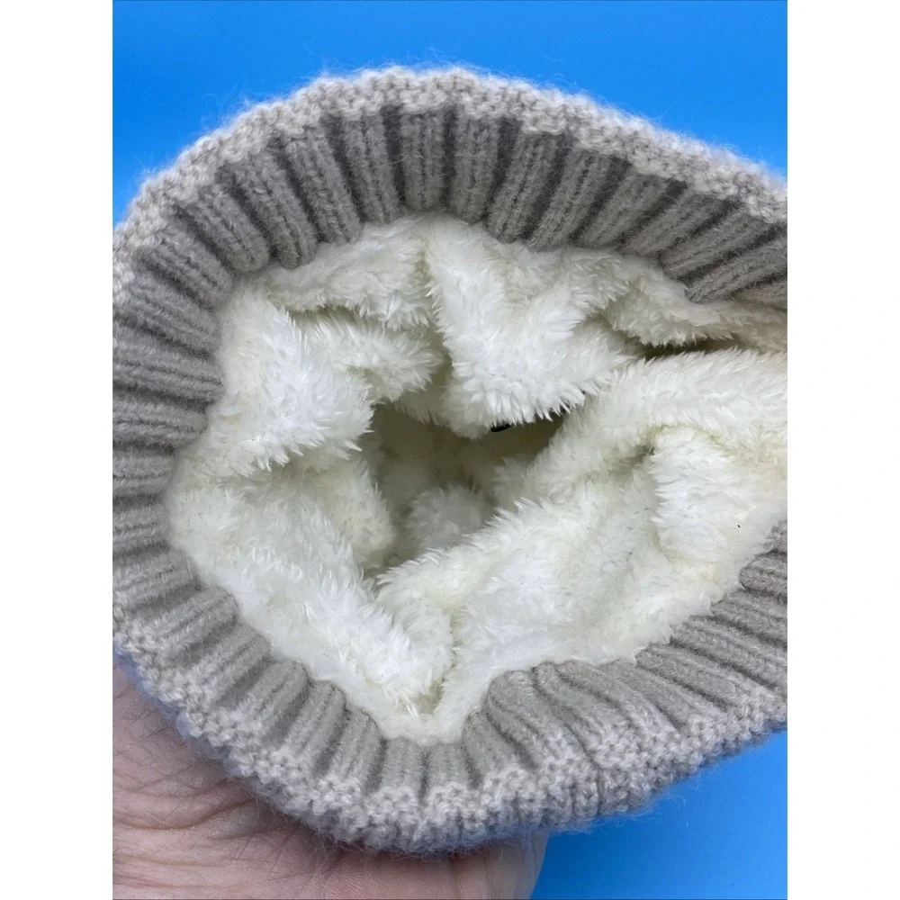 Britt's Knits Beige knit winter hat with faux fur pom pom